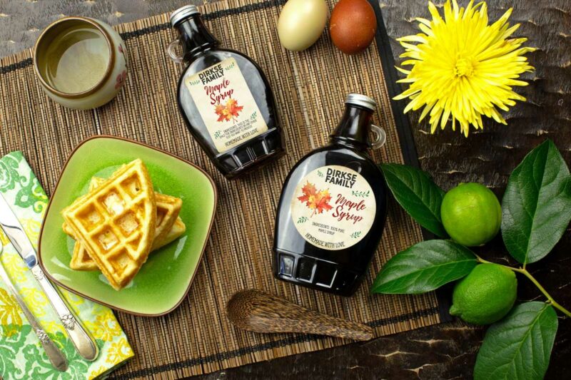 Customizable Vintage Style Maple Syrup Labels - shown on bottles of maple syrup with waffles and eggs with a decorative background.